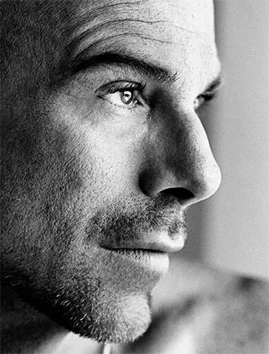 Black-and-white portrait of brand founder Manfred Thierry Mugler